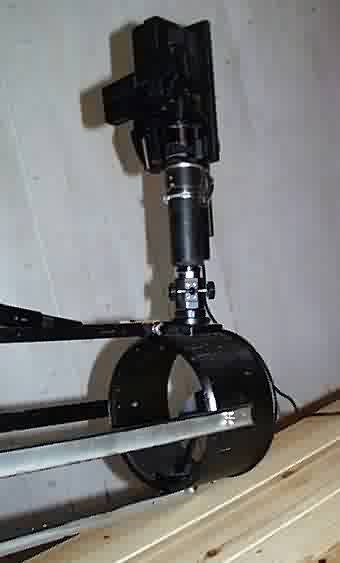21 cm reflector with video camera mounted.