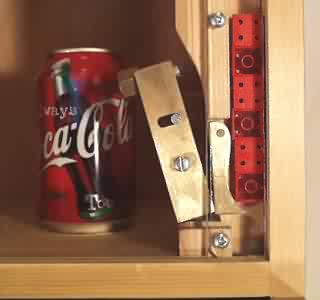 Close up of the track with tokens and latch mechanism.