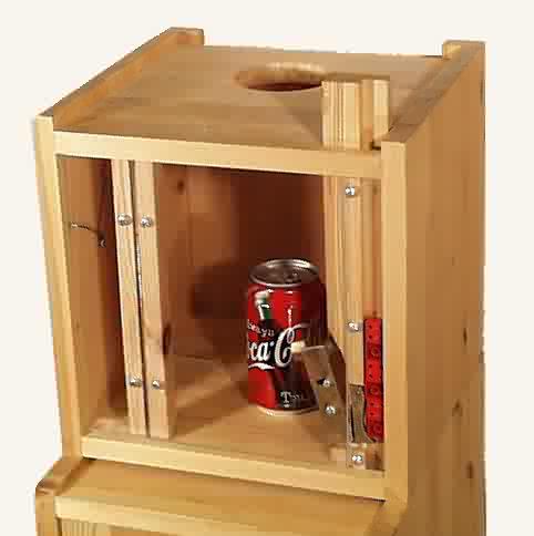 Image of reinforcer container with door open.